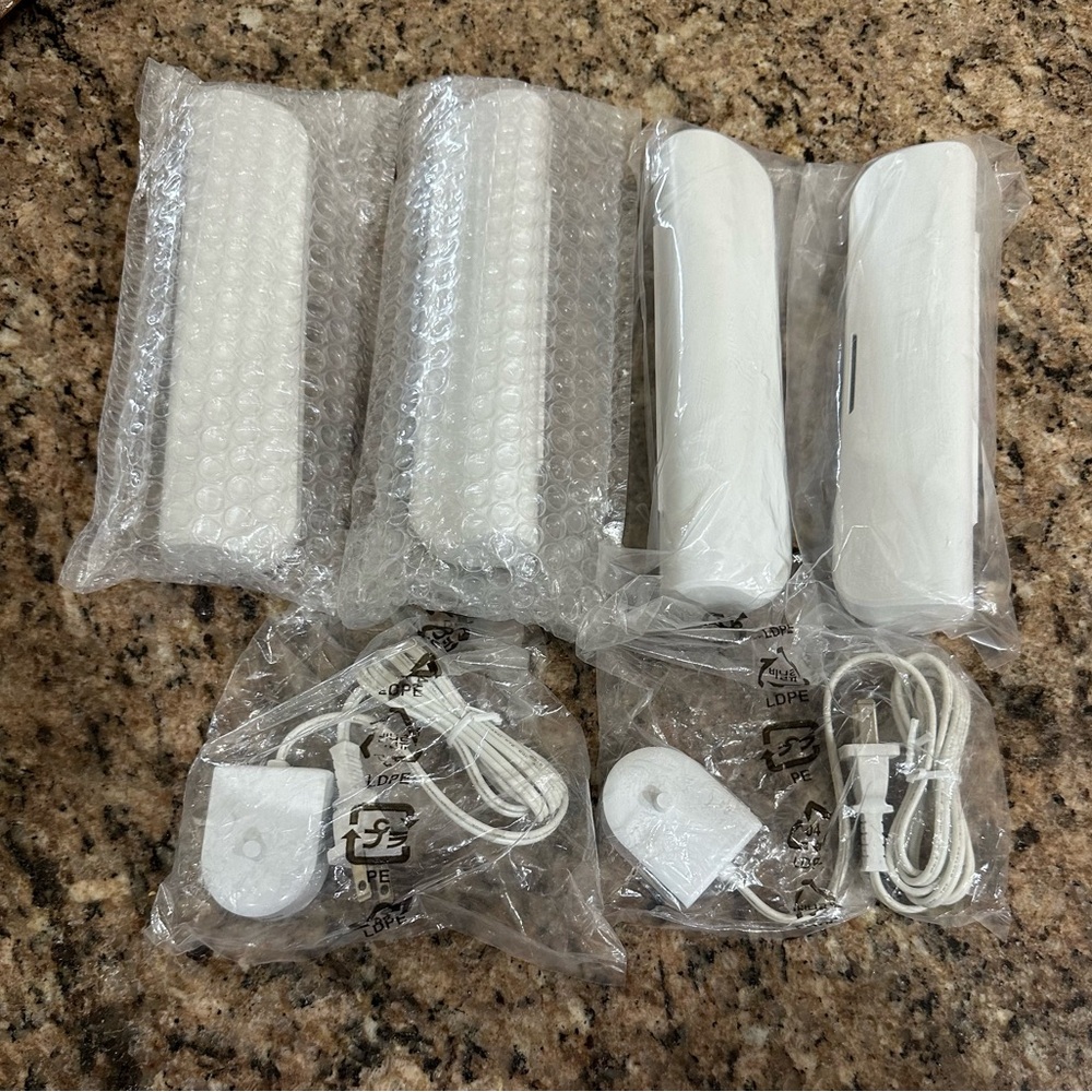 Brand new-4 Sonicare travel toothbrush holders and 2 chargers.